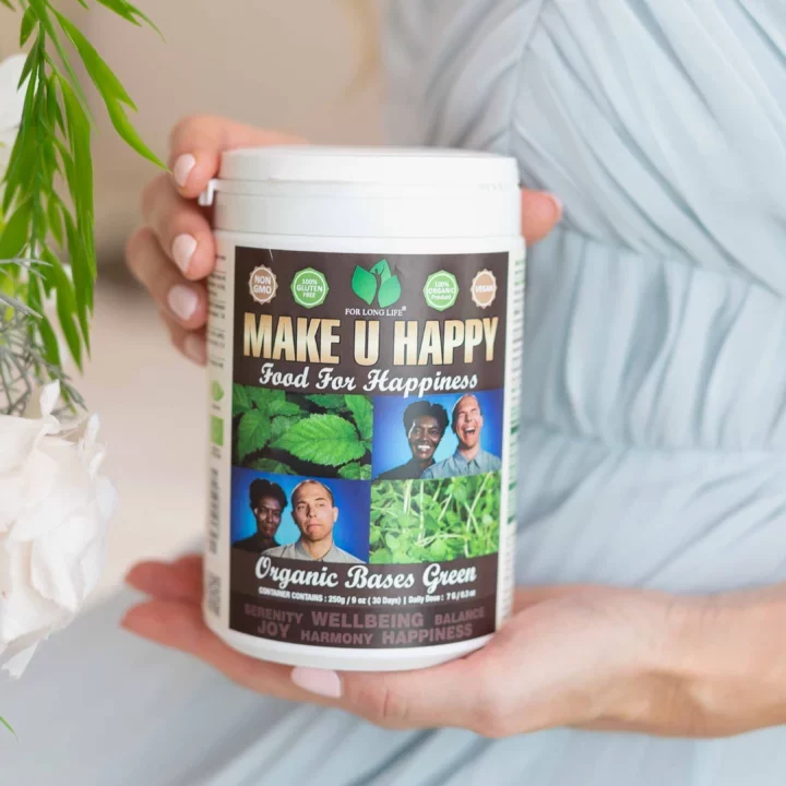 Ruka držící produkt Make U Happy pro zdraví a štěstí, bez GMO, bez lepku, veganské, organické ingredience.